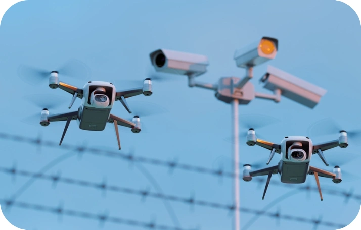 Security Drones Surveillance Security drones monitoring a perimeter with barbed wire