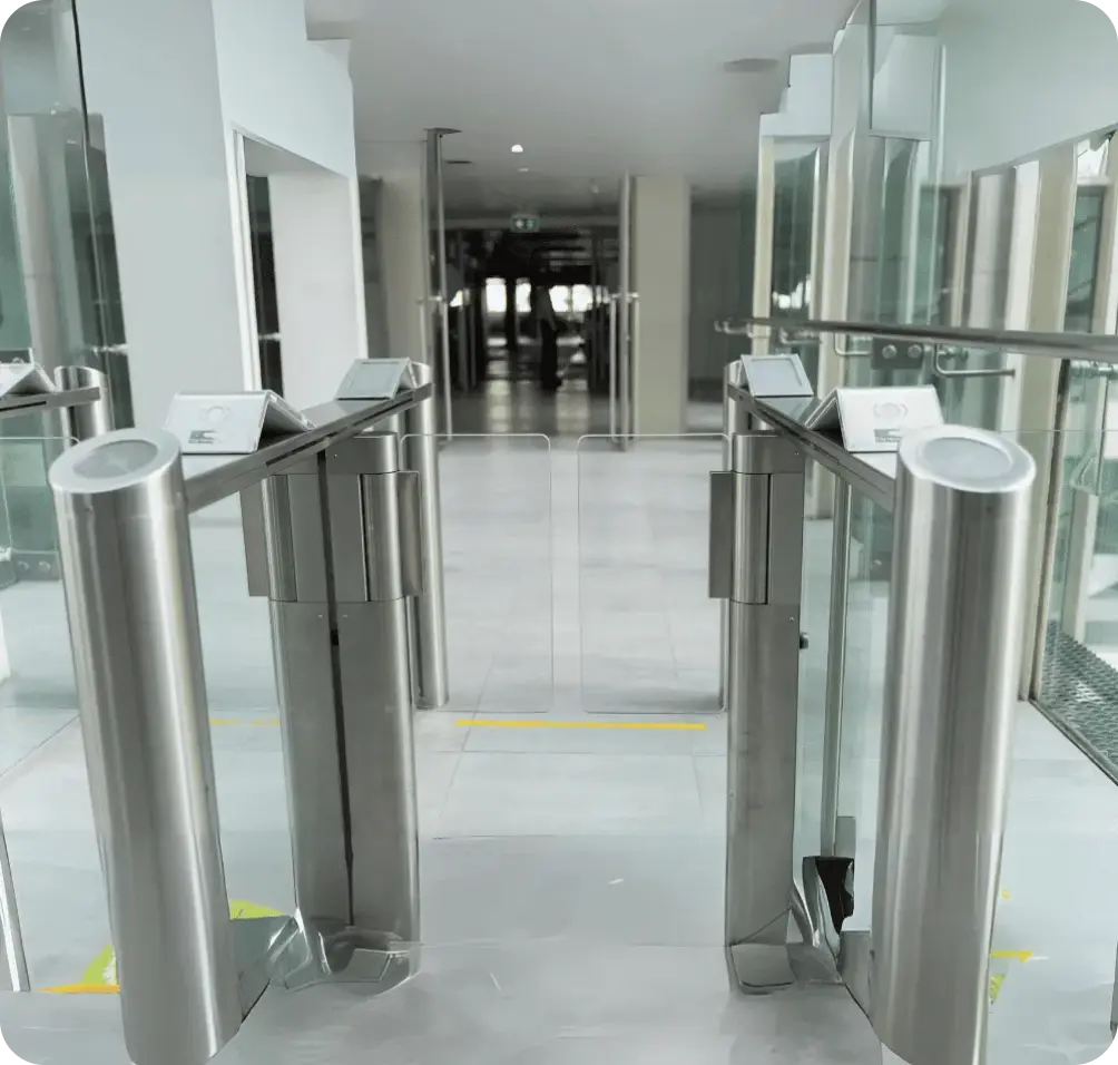 Modern entry gate with electronic access control systems in a secure facility.