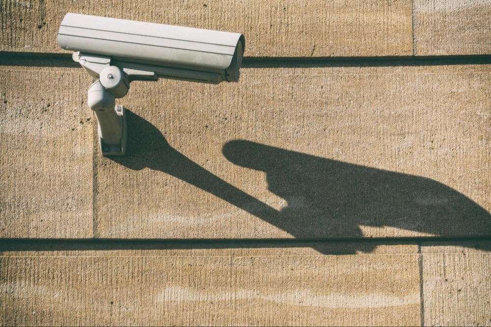 Commercial Security Camera & Surveillance Services | American Security Force (ASF) Wall-mounted commercial security camera providing 24/7 video surveillance, installed and monitored by American Security Force professional security services.