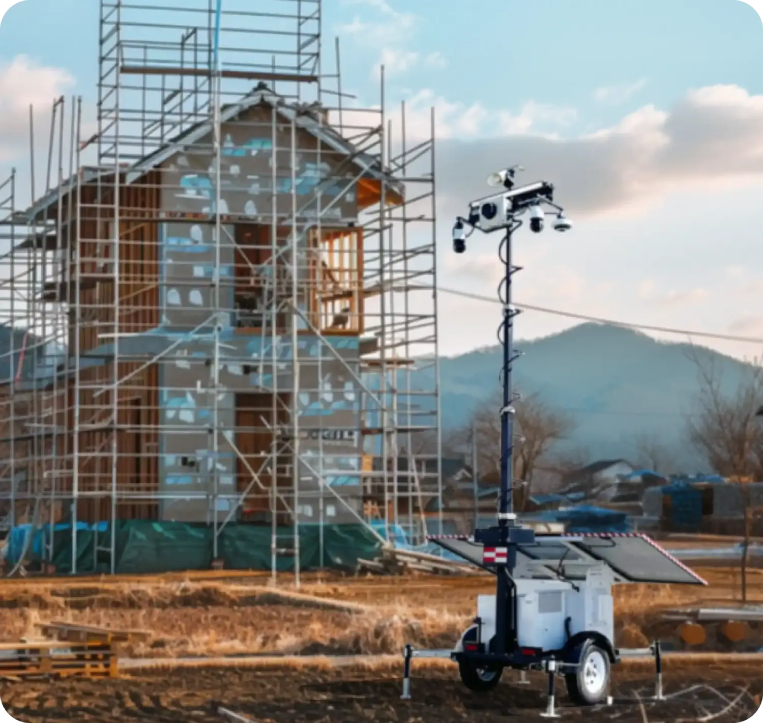 Mobile security trailer with cameras and solar panels monitoring a construction site