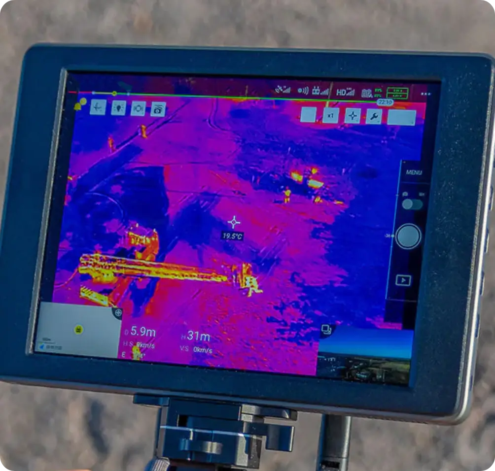 Thermal drone camera display showing live heat signatures for security surveillance