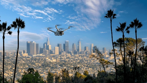 Drone Surveillance Over Los Angeles by American Security Force Surveillance drone from American Security Force flying above Los Angeles skyline, providing aerial security coverage over the city.