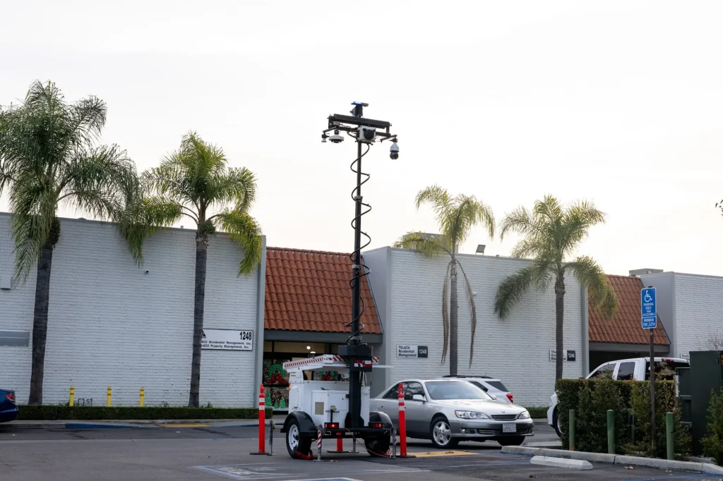 Mobile surveillance trailer with security cameras monitoring a commercial parking lot by American Security Force
