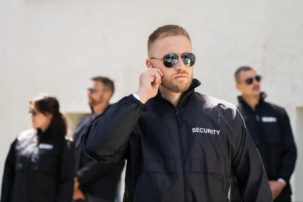 Executive Protection Security Team | American Security Force American Security Force executive protection team wearing security jackets and monitoring a site